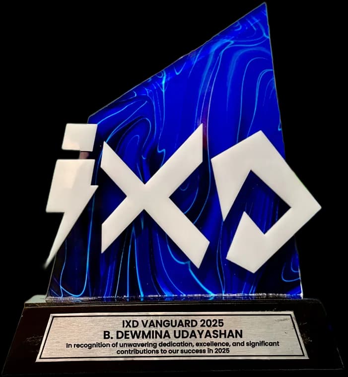 The IXD Vanguard 2025 award, engraved with Dewmina Udayashan's name